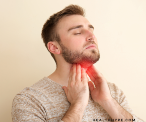 photo of a man experiencing throat pain that may indicate thyroid symptoms