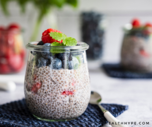 A hearty bowl of oatmeal topped with fresh berries, chia seeds, and honey drizzle.