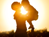 A mother gently cradling her baby, emphasizing self-care and personal well-being.