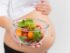 A woman happily eating fresh vegetables, emphasizing balanced nutrition and healthy eating habits.